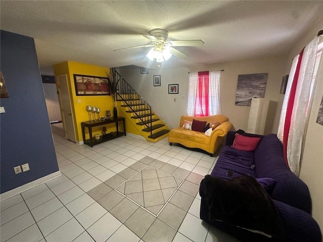 tiled living room with a textured ceiling and ceiling fan