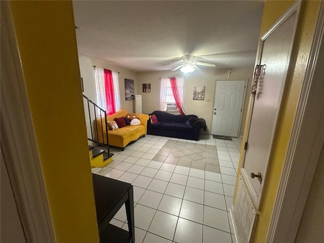 living room featuring light tile patterned floors, ceiling fan, and cooling unit