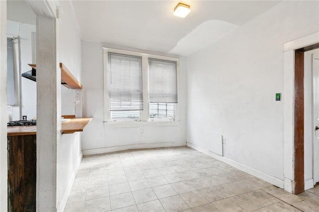 unfurnished dining area with light tile patterned floors