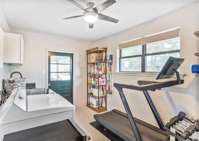 exercise room featuring independent washer and dryer and ceiling fan