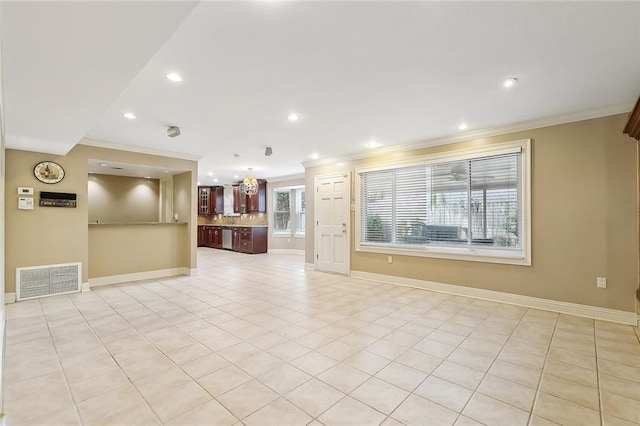 unfurnished living room with crown molding, light tile patterned flooring, and an inviting chandelier