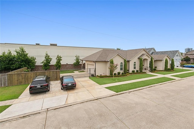 view of front facade featuring a garage and a front lawn