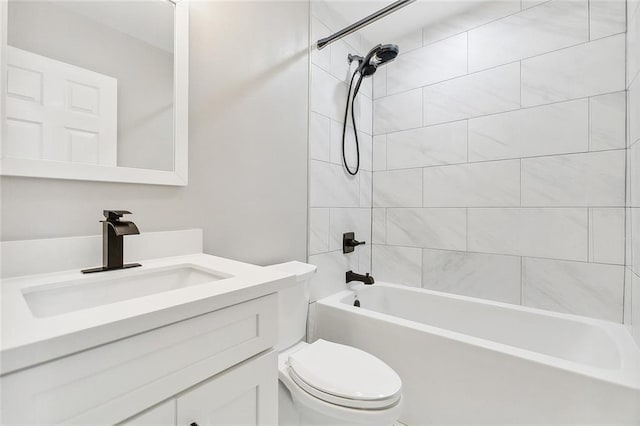 bathroom featuring washtub / shower combination, toilet, and vanity