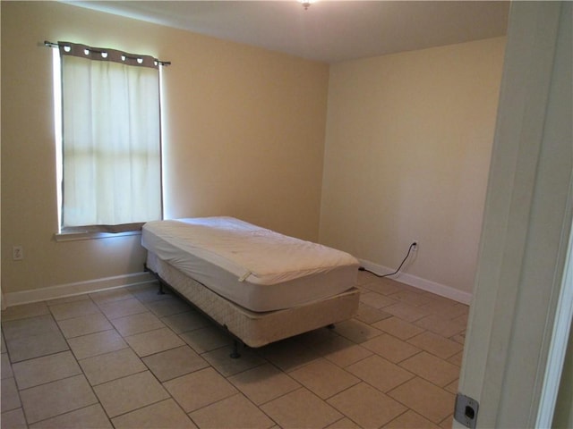 bedroom featuring light tile patterned floors