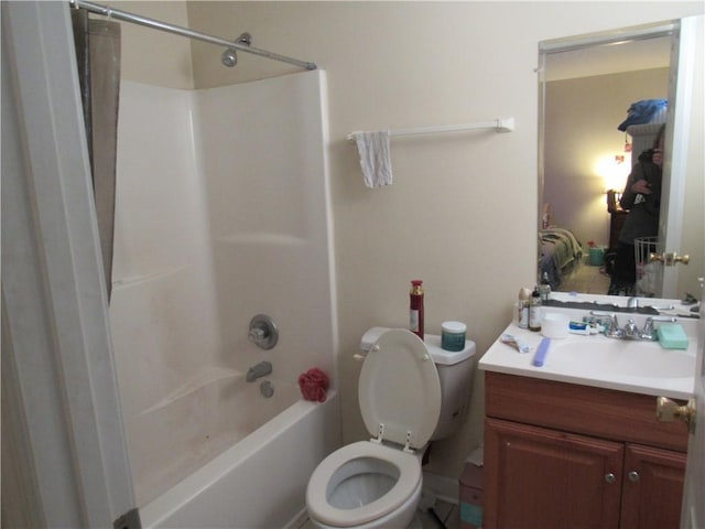 full bathroom featuring shower / bath combination, vanity, and toilet