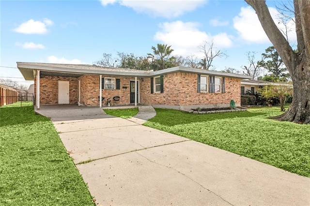 ranch-style house with a front yard and a carport