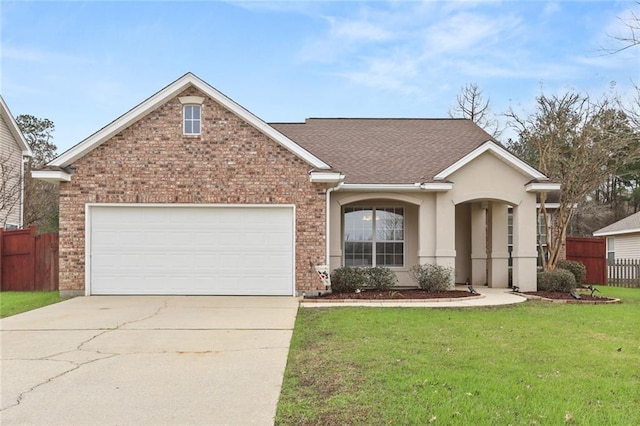 view of front of house featuring a garage and a front yard