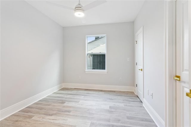 spare room featuring light hardwood / wood-style flooring and ceiling fan