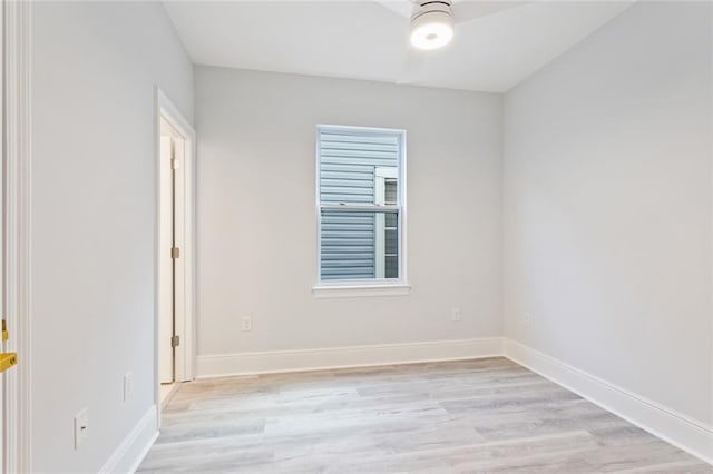 unfurnished room with ceiling fan and light wood-type flooring