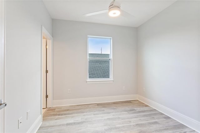 empty room featuring ceiling fan and light hardwood / wood-style flooring