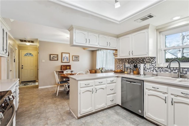 kitchen featuring appliances with stainless steel finishes, kitchen peninsula, sink, and white cabinets