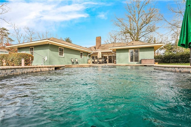 rear view of house featuring a patio