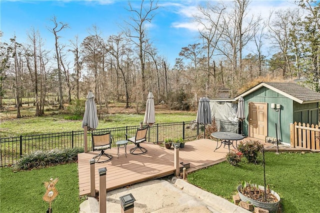 exterior space featuring a storage unit and a deck