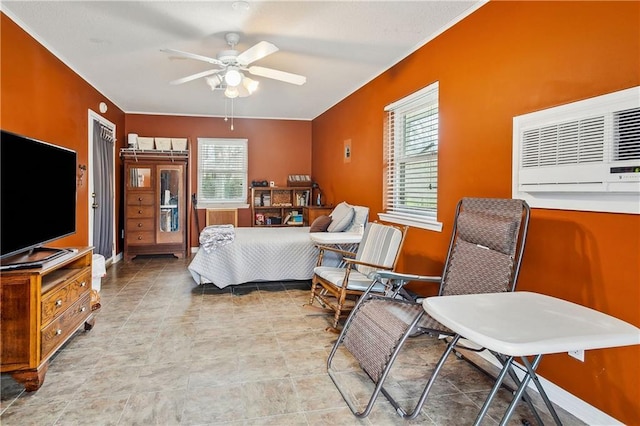 bedroom featuring multiple windows and ceiling fan