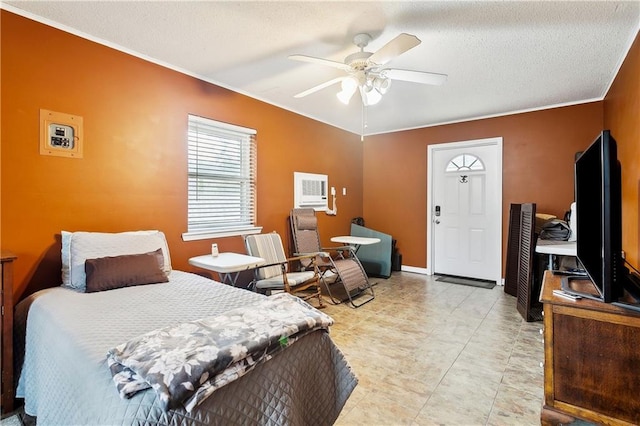 bedroom featuring ornamental molding, an AC wall unit, ceiling fan, and a textured ceiling