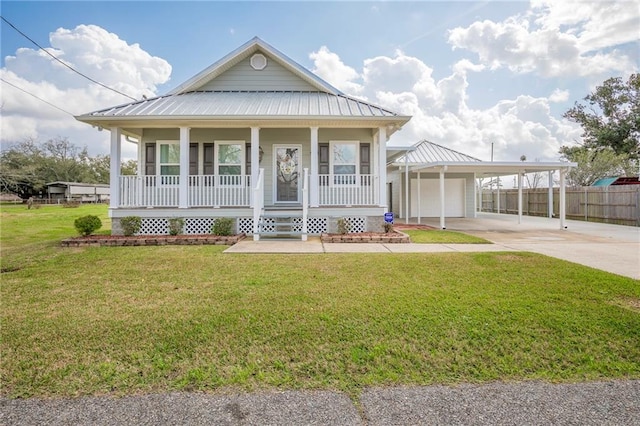 farmhouse with a porch, a garage, and a front lawn