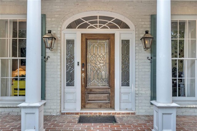 2809 Prytania St, New Orleans, LA 70115 - doorway to property featuring brick siding and a porch