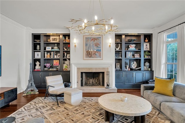 2809 Prytania St, New Orleans, LA 70115 - living area with a chandelier, crown molding, built in shelves, a high end fireplace, and wood finished floors