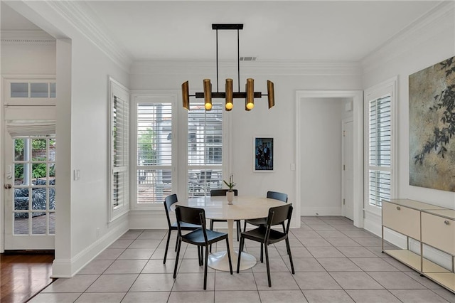2809 Prytania St, New Orleans, LA 70115 - dining space featuring plenty of natural light, light tile patterned flooring, ornamental molding, and baseboards