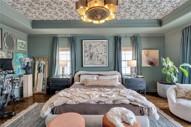 2809 Prytania St, New Orleans, LA 70115 - bedroom with a tray ceiling, wood finished floors, a chandelier, ornamental molding, and baseboards