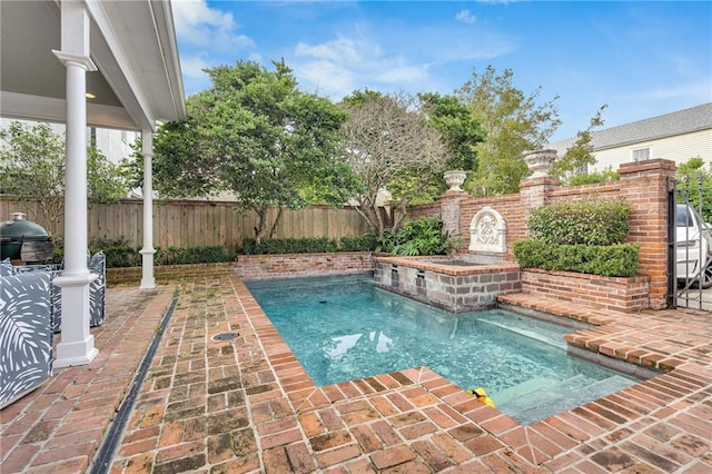 2809 Prytania St, New Orleans, LA 70115 - view of pool with a fenced backyard, area for grilling, and a patio