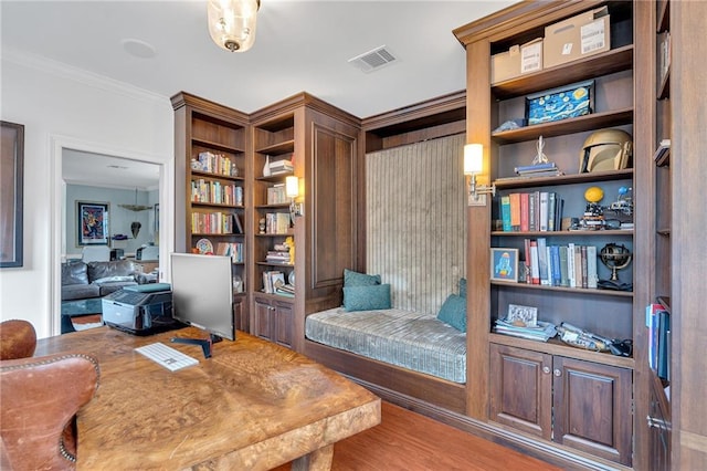 2809 Prytania St, New Orleans, LA 70115 - sitting room with ornamental molding and wood finished floors