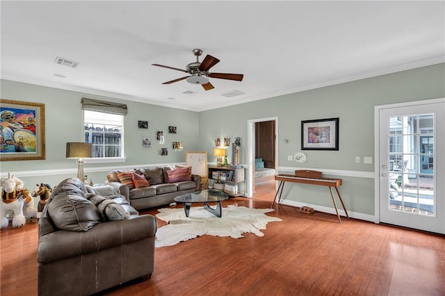 2809 Prytania St, New Orleans, LA 70115 - living area featuring a ceiling fan, wood finished floors, and ornamental molding