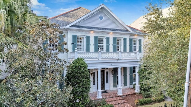 2809 Prytania St, New Orleans, LA 70115 - greek revival inspired property featuring a balcony and a shingled roof