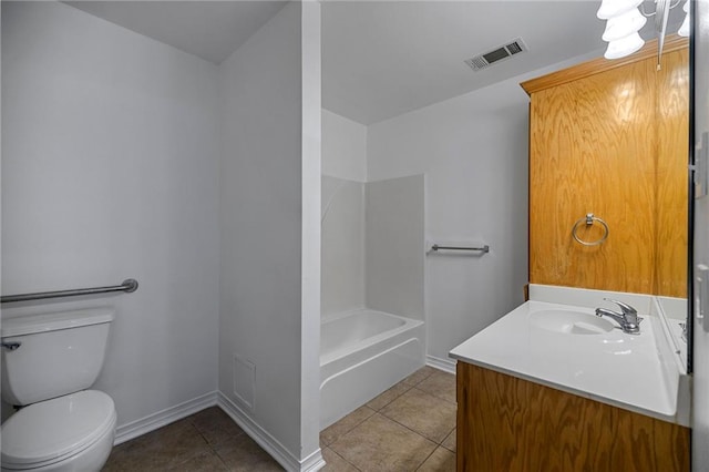 bathroom with vanity, tile patterned floors, and toilet