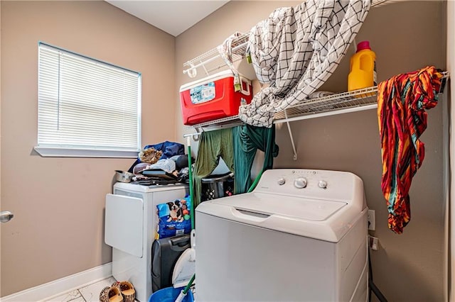 laundry area featuring washing machine and clothes dryer