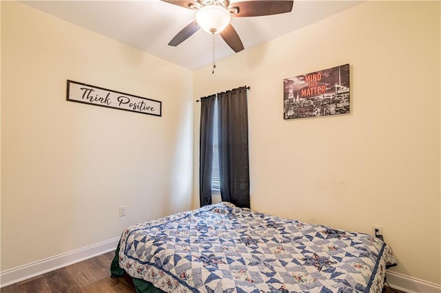 bedroom with ceiling fan and dark hardwood / wood-style flooring