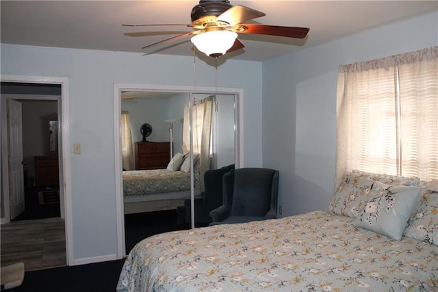 bedroom featuring ceiling fan and a closet