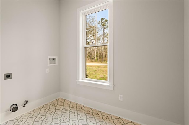 washroom with light tile patterned floors, hookup for a gas dryer, hookup for an electric dryer, laundry area, and washer hookup