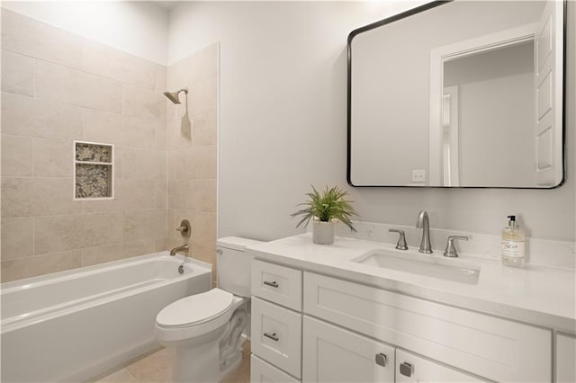 bathroom with tile patterned flooring, vanity, toilet, and shower / bathtub combination