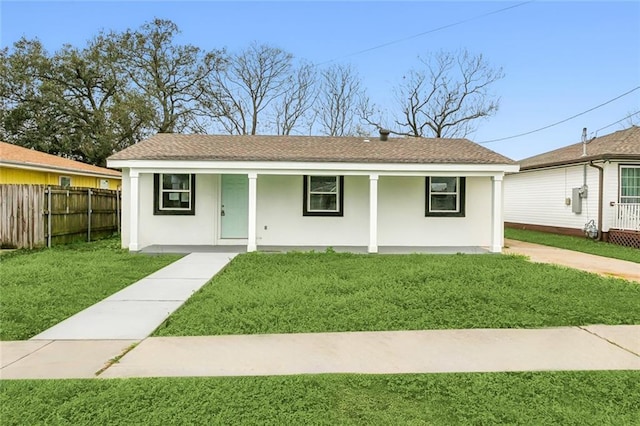 ranch-style house with a front yard and a porch