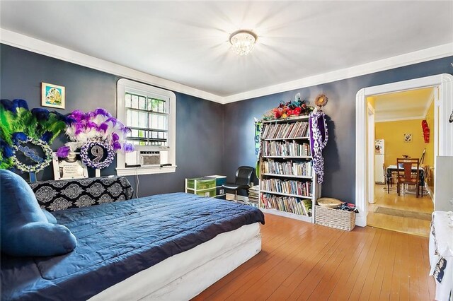 bedroom featuring cooling unit and hardwood / wood-style flooring