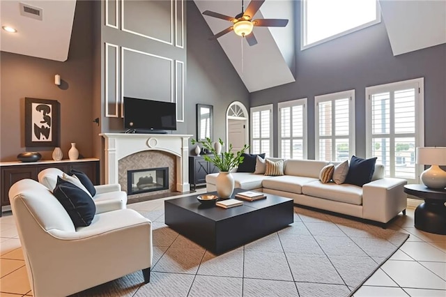 302 Charles Ct, Slidell, LA 70458 - living area featuring a high ceiling, a ceiling fan, tile patterned floors, a premium fireplace, and recessed lighting