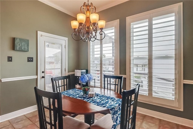 dining area featuring a notable chandelier, crown molding, and tile patterned floors