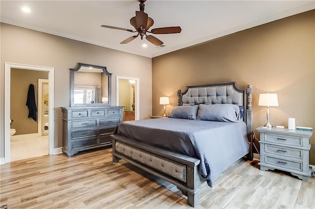 bedroom with crown molding, ceiling fan, connected bathroom, and light wood-type flooring