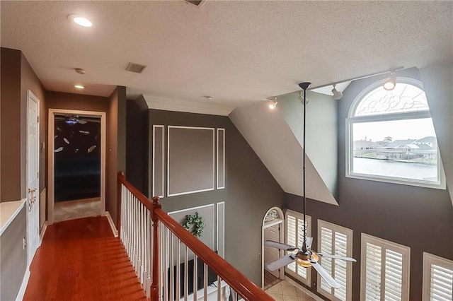 hallway featuring a textured ceiling