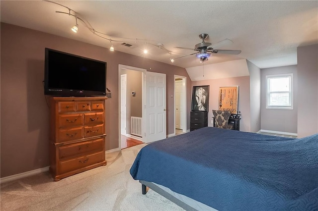 bedroom featuring ceiling fan, lofted ceiling, and carpet