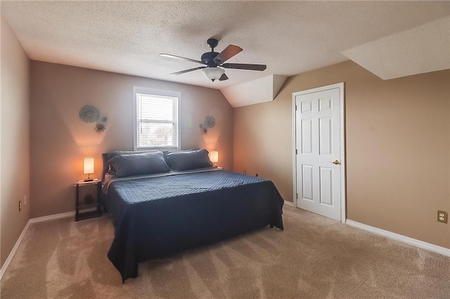 bedroom featuring ceiling fan, a textured ceiling, and carpet
