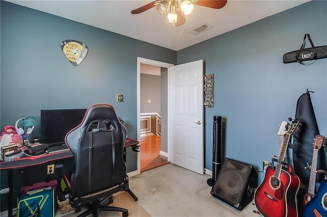 office area with light carpet and ceiling fan