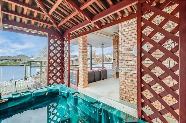 view of patio with a water view
