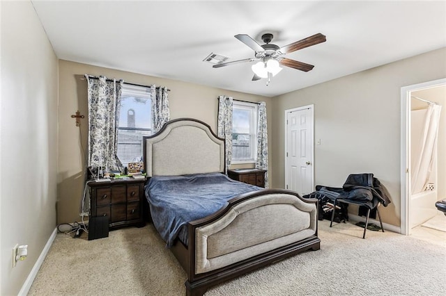 22830 22nd St, New Orleans, LA 70124 - carpeted bedroom featuring ceiling fan and ensuite bath