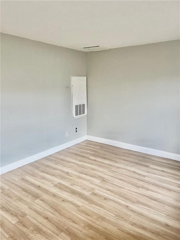 unfurnished room featuring light wood-type flooring