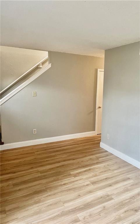 spare room featuring light hardwood / wood-style flooring