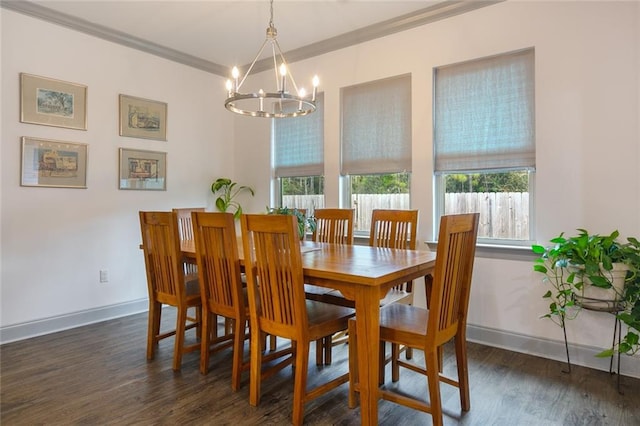 dining space featuring ornamental molding, dark hardwood / wood-style flooring, a chandelier, and a wealth of natural light