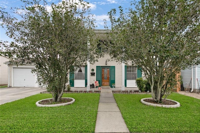 view of property hidden behind natural elements with an attached garage, a front yard, concrete driveway, and brick siding