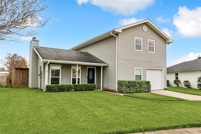 view of front of house featuring a garage and a front lawn